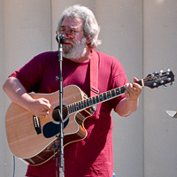 Explore photos of Jerry Garcia (wearing a red shirt!) Acoustic Band at Frost Amphetheater in Palo Alto July 09, 1988