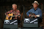 Doc Watson and David Holt peform on the Watson Stage at MerleFest 2006.